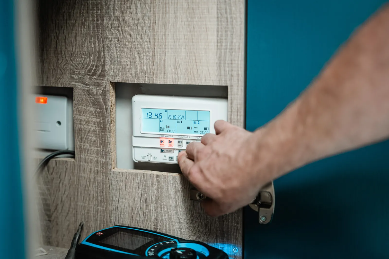 Heating and hot water time clock being set after a boiler service