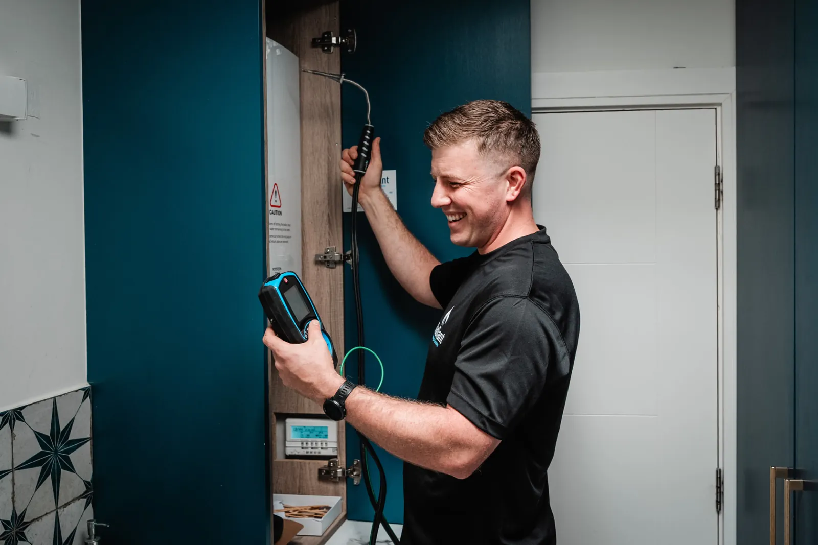 Radiant Heating & Plumbing engineer servicing a gas boiler